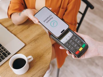 Diner paying using card machine.