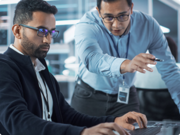 Two men examining data